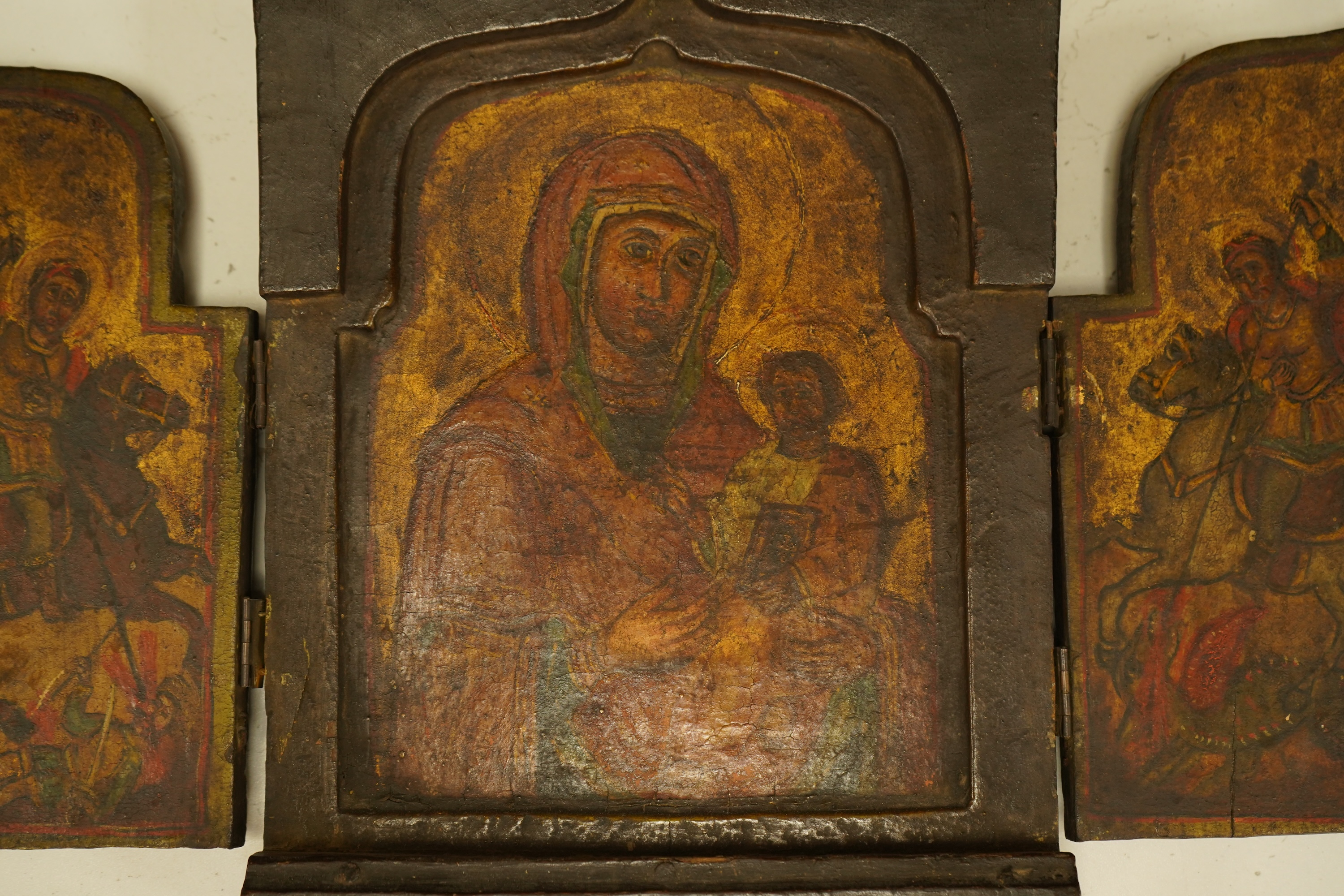 A painted wood triptych icon, 26cm high